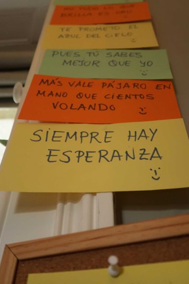 Colourful notes on a wall, with encouraging messages like "Always there is hope."